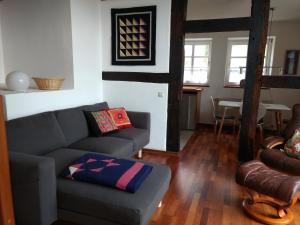 a living room with a couch and a table at Fewo Haus Patze in Betzendorf +26 photos