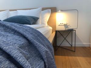Posteľ alebo postele v izbe v ubytovaní The Bridge Casa Luxury Apartments