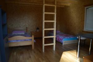 Postel nebo postele na pokoji v ubytování Metsjärve bangalo + 6 fotografií