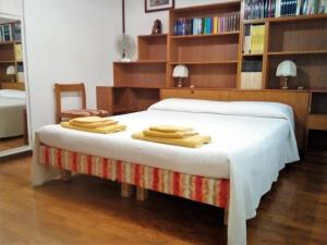 מיטה או מיטות בחדר ב-B&B Ponte Marchese