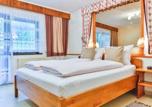 Postel nebo postele na pokoji v ubytování Hotel Pension Residence