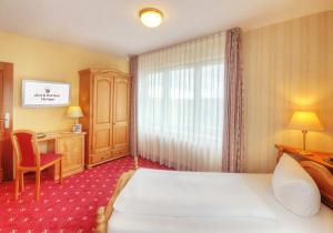 Postel nebo postele na pokoji v ubytování Akzent Aktiv & Vital Hotel Thüringen