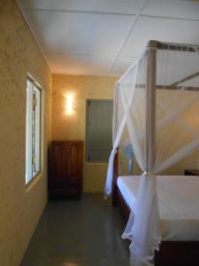 Våningssäng eller våningssängar i ett rum på Taragala Chalets