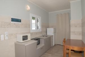 A kitchen or kitchenette at Chandris Apartments