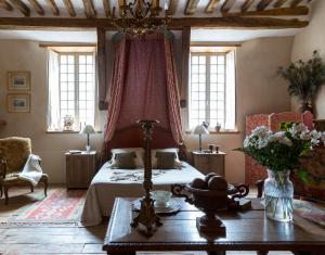 Posezení v ubytování Hôtel Tanquerey de La Rochaisière