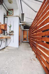 a hallway of a building with a wooden wall at Mayhow Donghe in Donghe