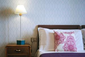 Postel nebo postele na pokoji v ubytování Hotel Galman + 2 fotografie