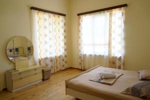Postel nebo postele na pokoji v ubytování Mimino Guest House
