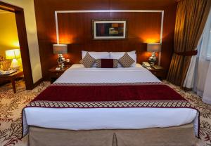 Postel nebo postele na pokoji v ubytování Ramee Royal Hotel