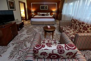 Postel nebo postele na pokoji v ubytování Ramee Royal Hotel