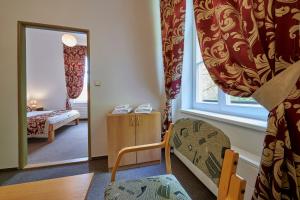 Posteľ alebo postele v izbe v ubytovaní Hotel Mezní Louka
