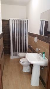 a bathroom with a toilet and a sink at Etna Winery in Zafferana Etnea