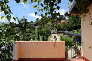 a view of a garden from the balcony of a house at Villa Eleanto in Cefalù