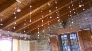 a room with a bunch of lights hanging from the ceiling at Farm stay Agriturismo la Borgaccia in Baiso