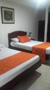 Postel nebo postele na pokoji v ubytování Hotel Center