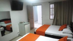 Postel nebo postele na pokoji v ubytování Hotel Center
