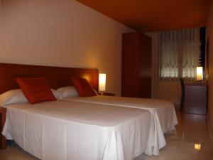 Un pat sau paturi într-o cameră la Hotel Verti