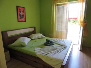 Postel nebo postele na pokoji v ubytování Apartment GREEN Jelsa