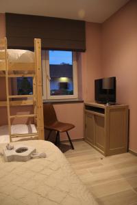 TV a/nebo společenská místnost v ubytování B&B Dotter 17