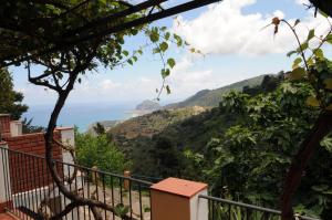 a view of the ocean from the balcony of a house at Villa Eleanto in Cefalù