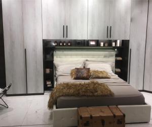 Postel nebo postele na pokoji v ubytování Le case di Loris