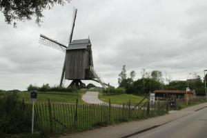 a windmill sitting on the side of a road at Dotter 17 in Erpe-Mere