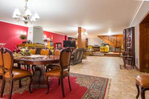 a dining room with a table and chairs at Casa da Quinta Nova in Valença