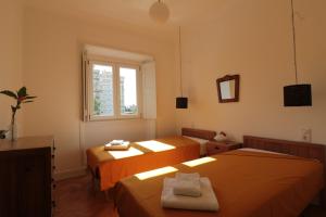 a room with two beds and a window at Casa d Sintra 2 in Sintra