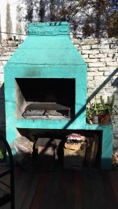 an outdoor pizza oven sitting on a deck at Patio de Molina a 100m de la Plaza del Folkore in Cosquín