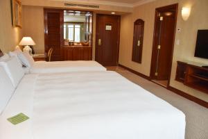 Voodi või voodid majutusasutuse Evergreen Laurel Hotel Taipei toas