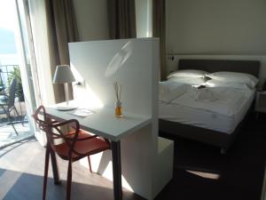 Voodi või voodid majutusasutuse Albergo Dongo toas