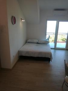 Posteľ alebo postele v izbe v ubytovaní Apartments Berti