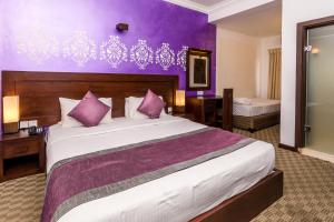 Voodi või voodid majutusasutuse Ceylon City Hotel,Colombo toas