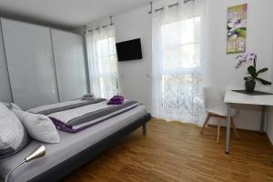 Postel nebo postele na pokoji v ubytování Am Meerbach