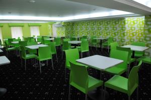 Restoran või mõni muu söögikoht majutusasutuses Manhattan Hotel & Restaurant