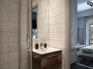 a bathroom with a sink and a mirror at Yasemi Studio 1 in Heraklio