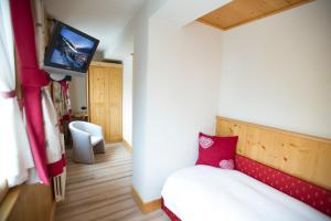 Postel nebo postele na pokoji v ubytování Hotel Funivia
