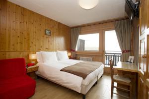 Postel nebo postele na pokoji v ubytování Hotel Funivia