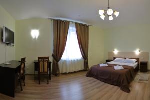 Postel nebo postele na pokoji v ubytování Hotel Karpaty