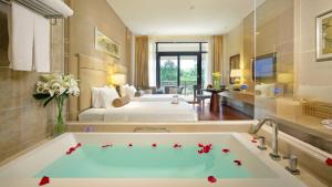 A bed or beds in a room at Dahongpao Resort