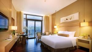 A bed or beds in a room at Dahongpao Resort