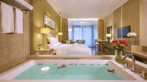 A bed or beds in a room at Dahongpao Resort