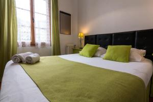 Postel nebo postele na pokoji v ubytování Ma Petite Auberge