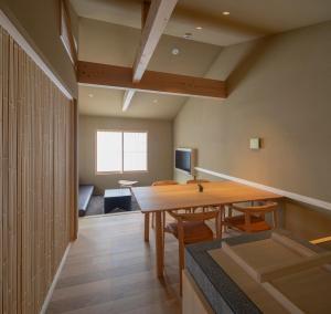 a dining room with a table and chairs at Campton Kiyomizu Vacation Rental in Kyoto