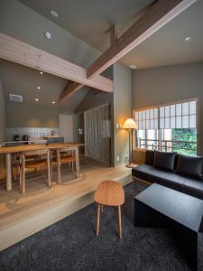 a living room with a couch and a table at Campton Kiyomizu Vacation Rental in Kyoto