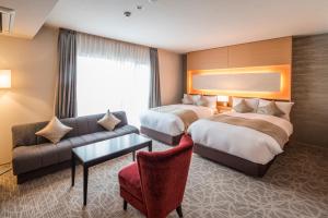Voodi või voodid majutusasutuse Kyoto Shinmachi Rokkaku Hotel grandereverie toas
