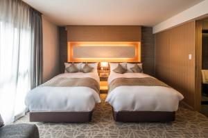 Voodi või voodid majutusasutuse Kyoto Shinmachi Rokkaku Hotel grandereverie toas