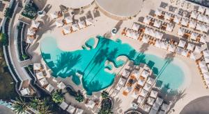 an aerial view of a pool at a resort at Iberostar Selection Sábila - Adults Only in Adeje