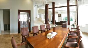 a dining room with a wooden table and chairs at Nancy Sweet Villa in Vung Tau