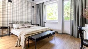 Posteľ alebo postele v izbe v ubytovaní A+ apartament Rajska